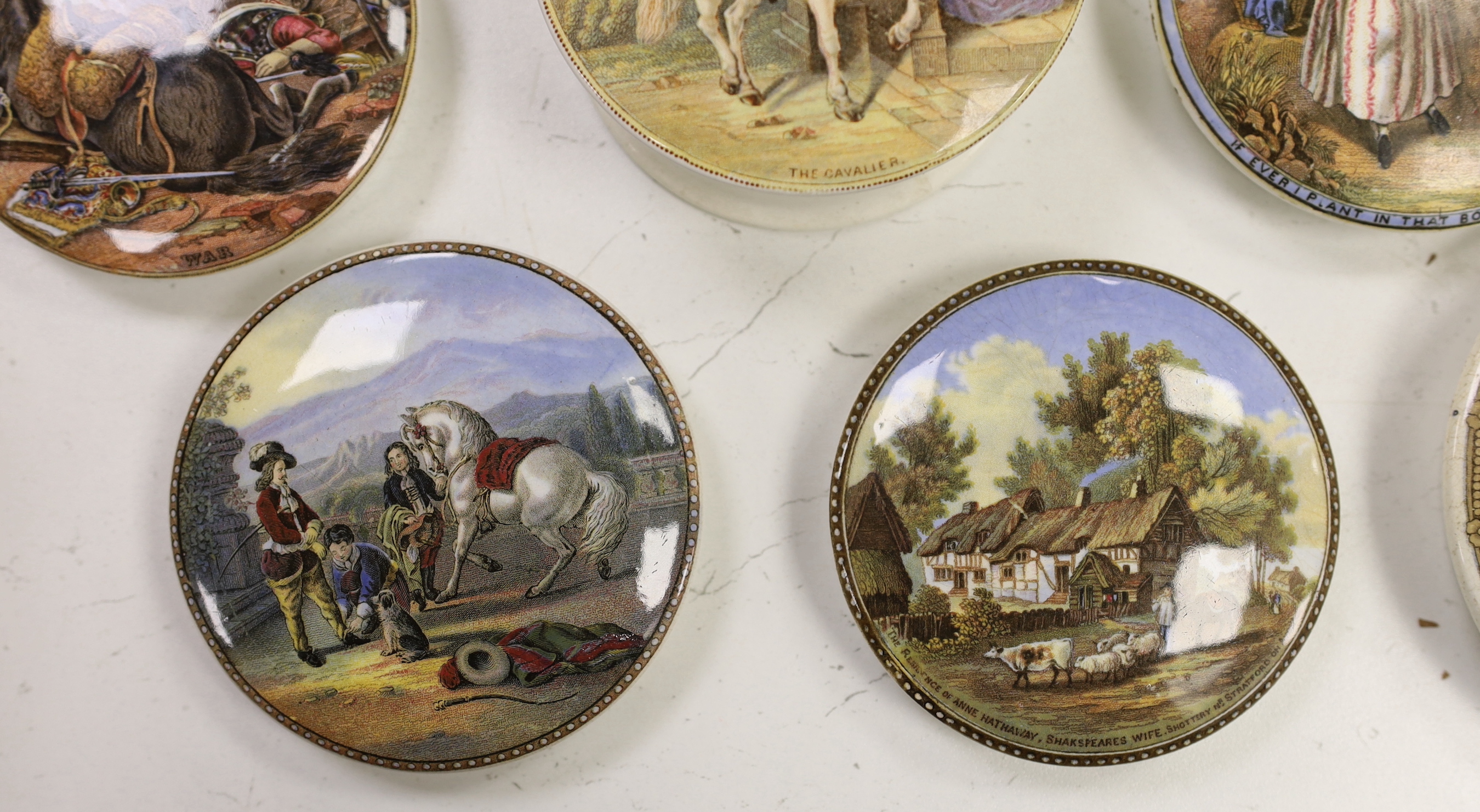 Seven various pot lids, The Cavalier, with base, War and five others